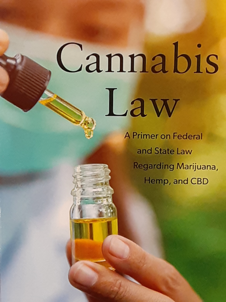 Book cover of 'Cannabis Law' showing an eyedropper filled with an amber liquid dripping it into a vial with more of the same liquid.